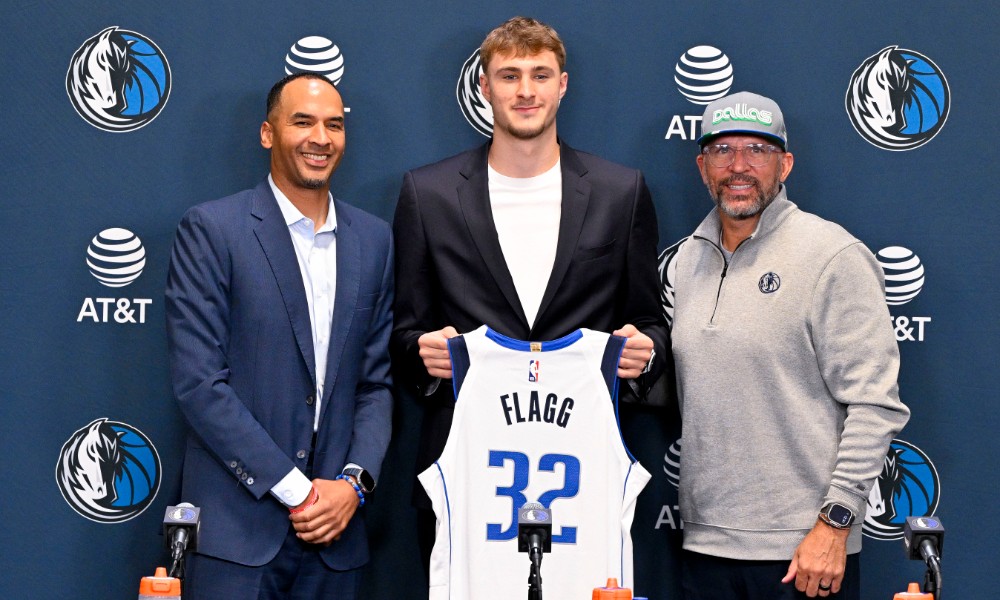 Cooper Flagg holds jersey