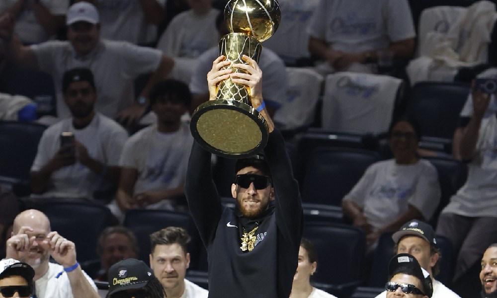 Chet Holmgren holds championship trophy