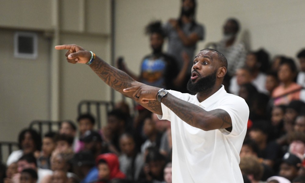 LeBron James points during a basketball event