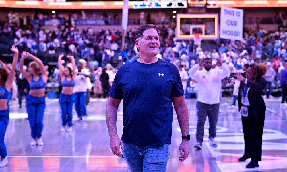 Mark Cuban walks before game