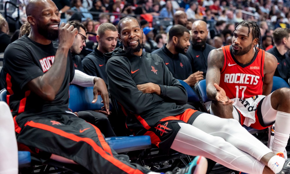 Kevin Durant smiles on bench