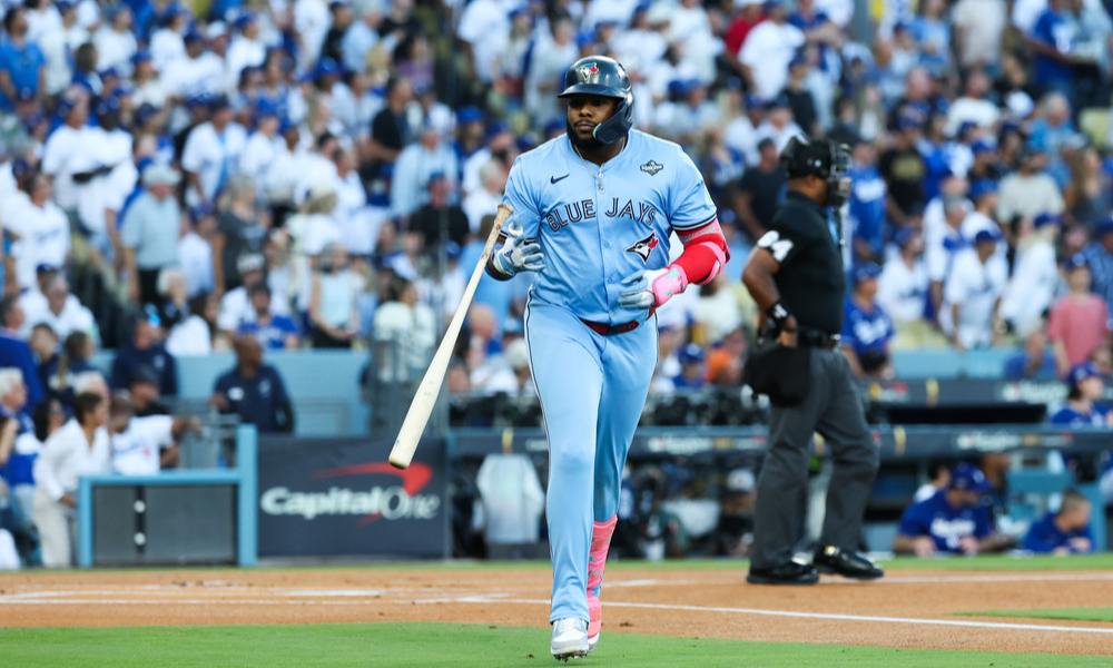 Vladimir Guerrero Jr. tosses his bat away after hitting a home run in the first inning of Game 5 of the 2025 World Series.