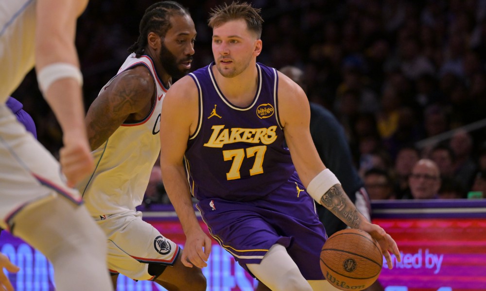 Luka Doncic drives against Kawhi Leonard