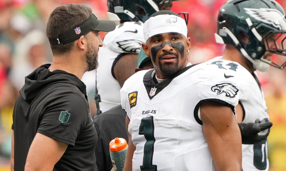 Closeup shot of Philadelphia Eagles head coach Nick Sirianni speaking to quarterback Jalen Hurts.