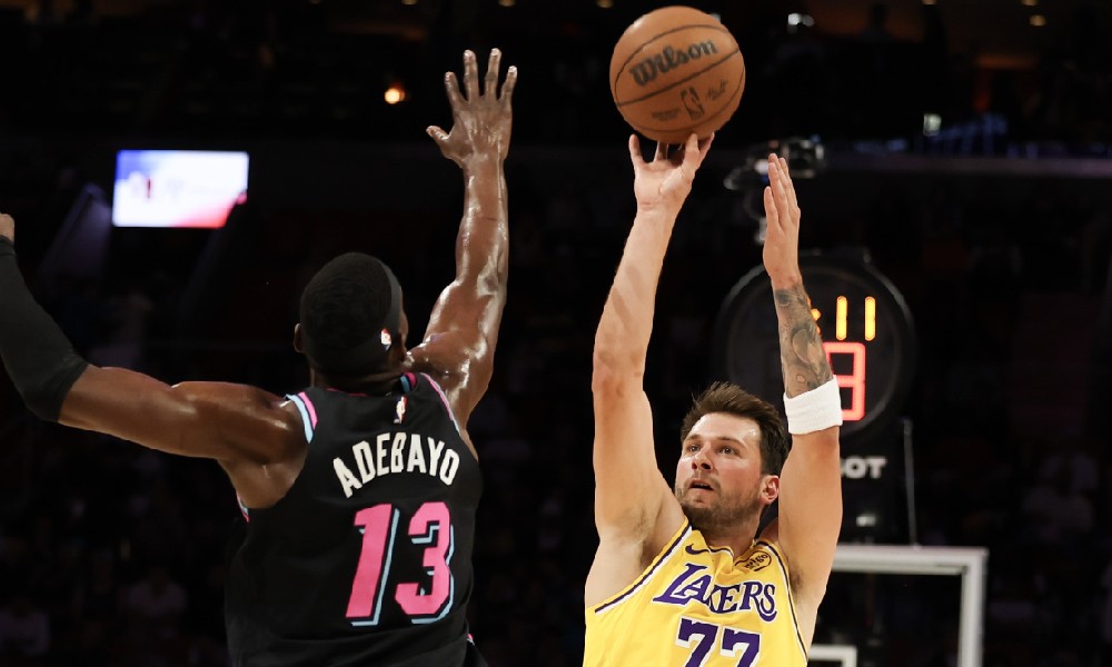 Luka Doncic shoots over Bam Adebayo
