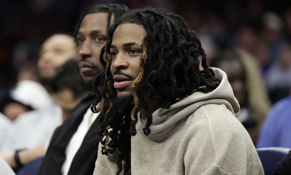 Memphis Grizzlies guard Ja Morant watches from the bench during the second half against the Charlotte Hornets at Spectrum Center.