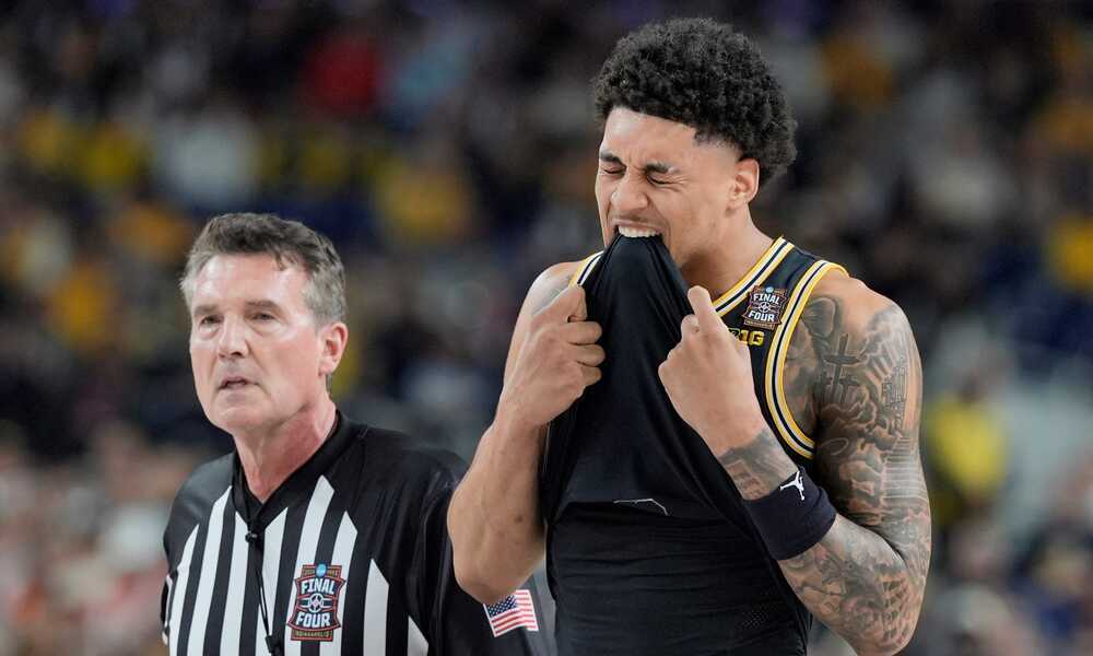 Michigan Wolverines star Yaxel Lendeborg reacts after suffering an injury in the Final Four.