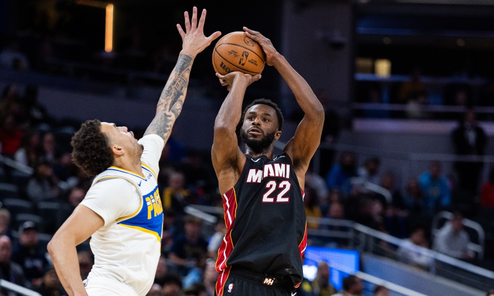 Miami Heat forward Andrew Wiggins (22) shoots the ball while Indiana Pacers forward Jalen Slawson (18) defends in the second half at Gainbridge Fieldhouse. Mandatory Credit: Trevor Ruszkowski-Imagn Images