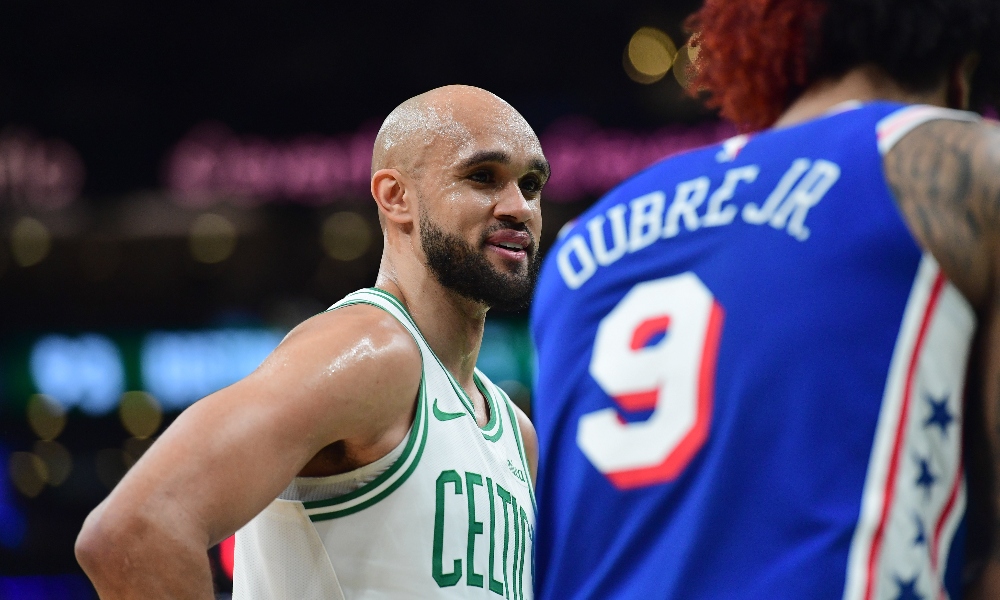 Boston Celtics guard Derrick White (9) talks with Philadelphia 76ers guard Kelly Oubre Jr. (9) in the second half during game one of the first round of the 2026 NBA Playoffs at TD Garden. Mandatory Credit: Bob DeChiara-Imagn Images
