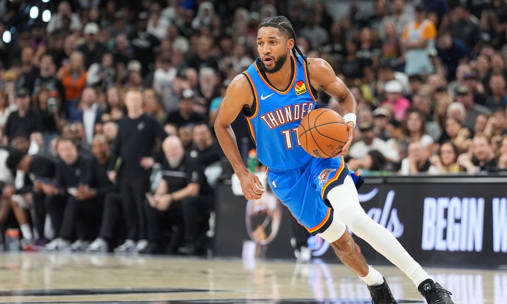Oklahoma City Thunder guard Isaiah Joe (11) moves the ball in the fourth quarter against the San Antonio Spurs during game four of the western conference finals for the 2026 NBA playoffs at Frost Bank Center. Mandatory Credit: Daniel Dunn-Imagn Images