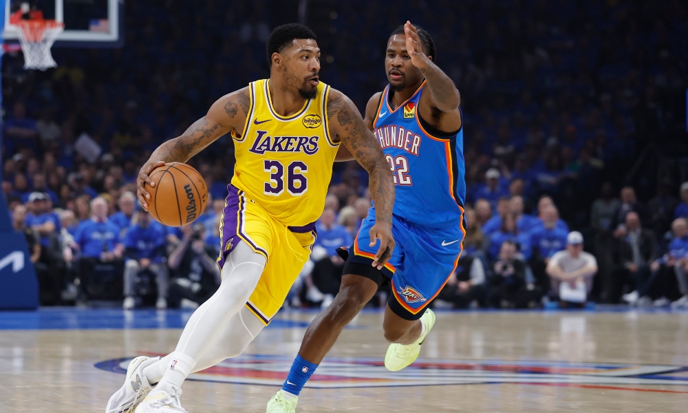 Los Angeles Lakers guard Marcus Smart (36) moves the ball around Oklahoma City Thunder guard Cason Wallace (22) in the first half during game one of the second round of the 2026 NBA Playoffs at Paycom Center. Mandatory Credit: Alonzo Adams-Imagn Images