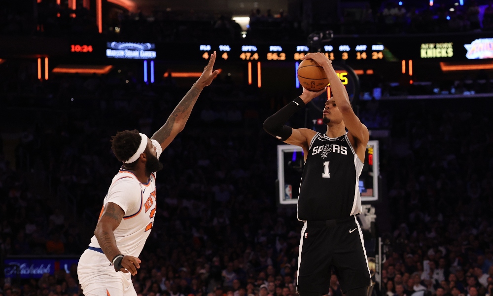 San Antonio Spurs forward Victor Wembanyama (1) shoots the ball as New York Knicks center Mitchell Robinson (23) defends during game three of the 2026 NBA Finals at Madison Square Garden. Mandatory Credit: Geoff Burke-Imagn Images