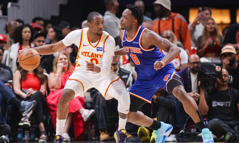 Atlanta Hawks forward Jonathan Kuminga (0) is defended by New York Knicks forward Og Anunoby (8) in the second quarter during game six of the first round of the 2026 NBA Playoffs at State Farm Arena. Mandatory Credit: Brett Davis-Imagn Images