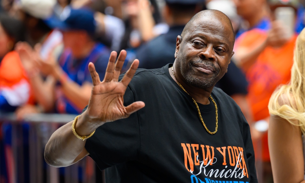 New York, NY, USA; Former New York Knicks center Patrick Ewing waves to the crowd during the New York Knicks Championship Parade through the Canyon of Heroes. Mandatory Credit: Brenden Willsch-Imagn Images