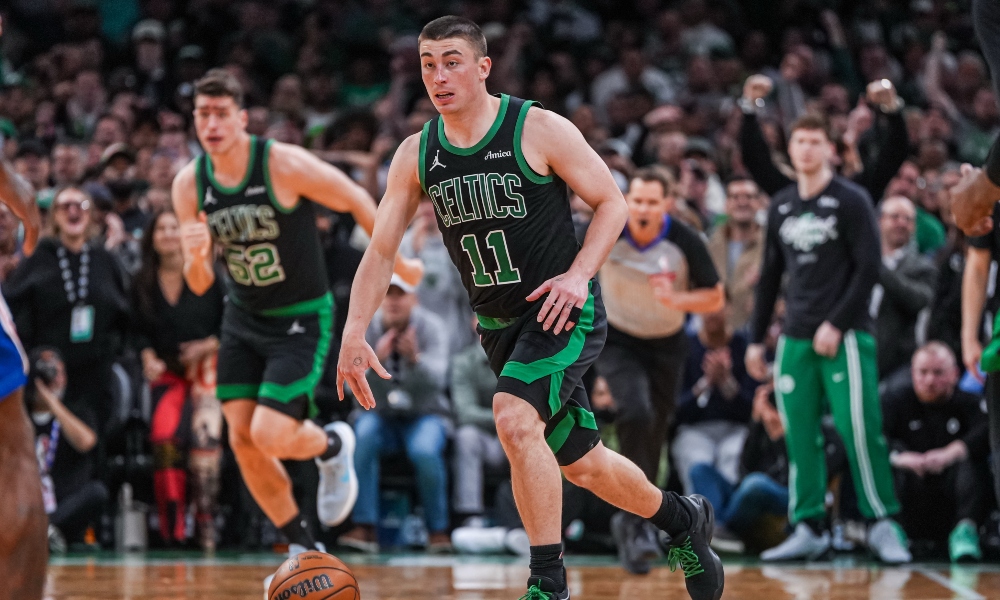 Boston Celtics guard Payton Pritchard (11) returns the ball against the Philadelphia 76ers in the second half during game five of the first round of the 2026 NBA Playoffs at TD Garden. Mandatory Credit: David Butler II-Imagn Images