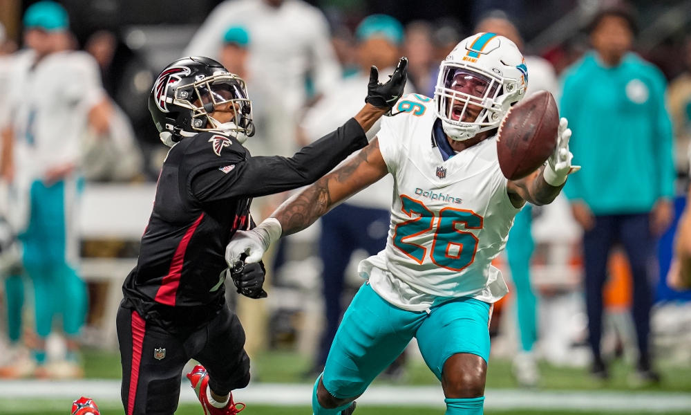 Miami Dolphins cornerback Rasul Douglas (26) is called for pass interference while defending Atlanta Falcons wide receiver Darnell Mooney (1) during the second half at Mercedes-Benz Stadium. Mandatory Credit: Dale Zanine-Imagn Images