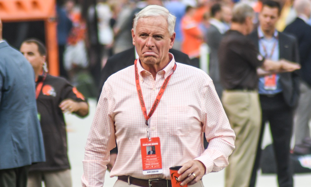 Jimmy Haslam holding a cup on his hand.