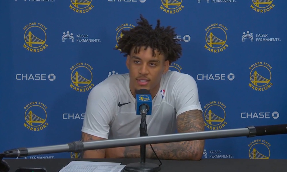 Yaxel Lendeborg sitting at a press conference.